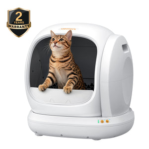 White Meowant self-cleaning litter box with tabby cat, 2-year warranty badge.