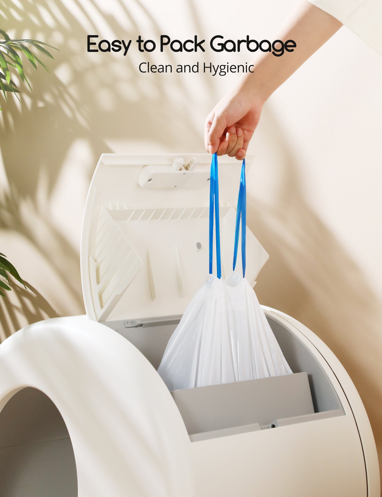 Hand removing a full double drawstring liner from a MeoWant automatic cat litter box, emphasizing easy and hygienic garbage disposal